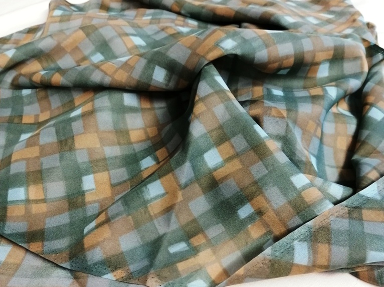Groen-beige geruite synthetische stof 1,4/0,90