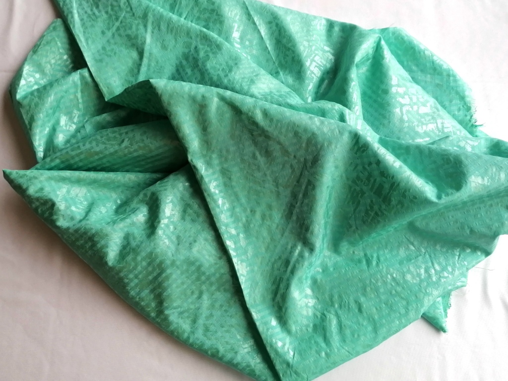Jaren 90 jacquard satijn lichtgroen mat blinkend