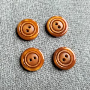 roestbruine knoop met ronde randen 23mm
