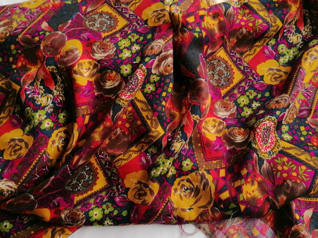 Jaren 70 wolachtige stof bloemen paisley oranje rood