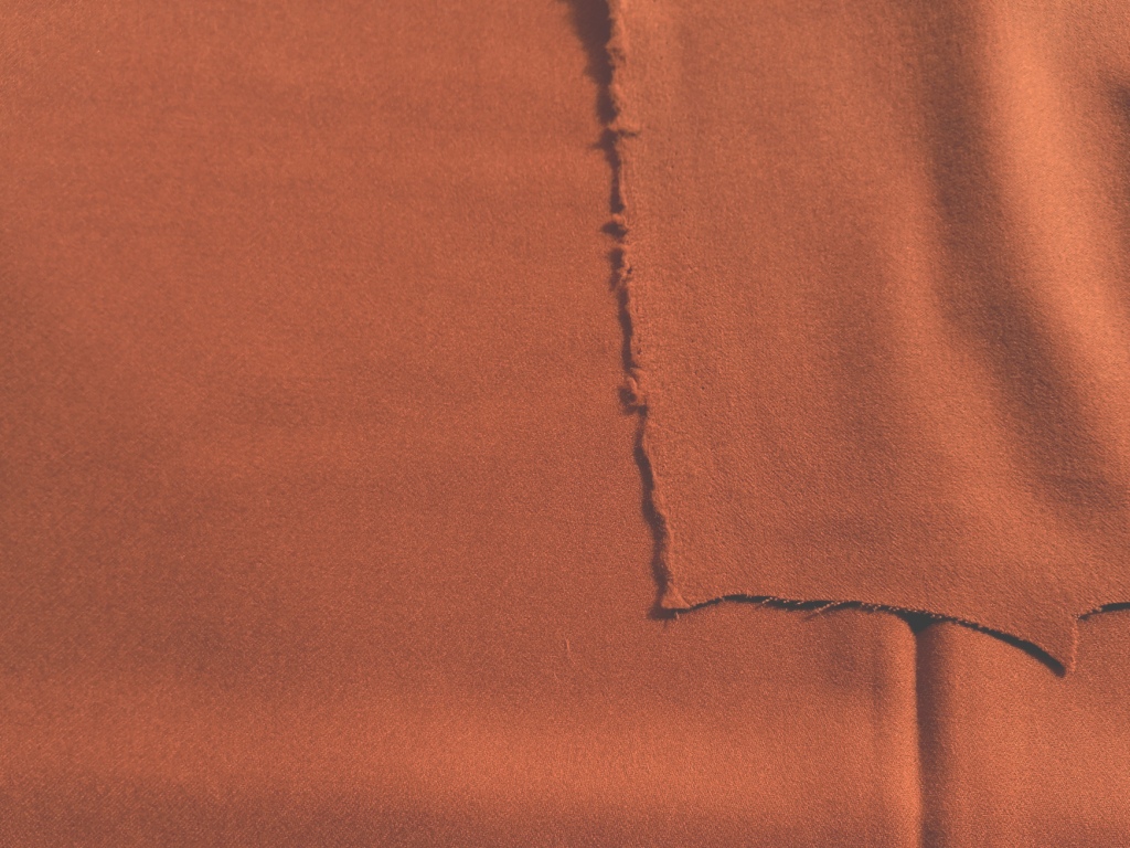 Detail van zachte roodoranje flanel in wol
