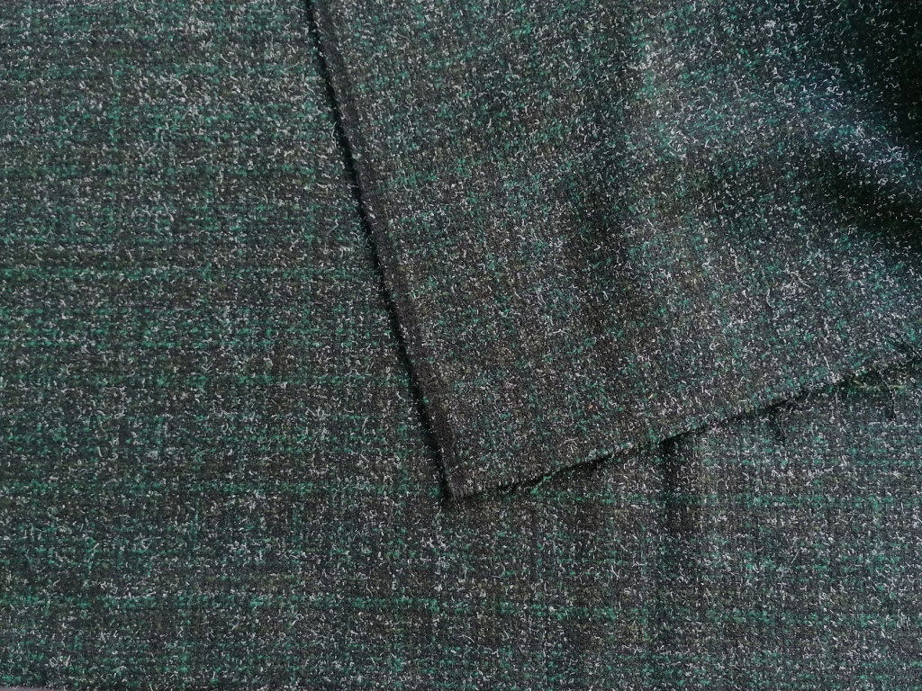 Detail van gemêleerde wollen tweed stof