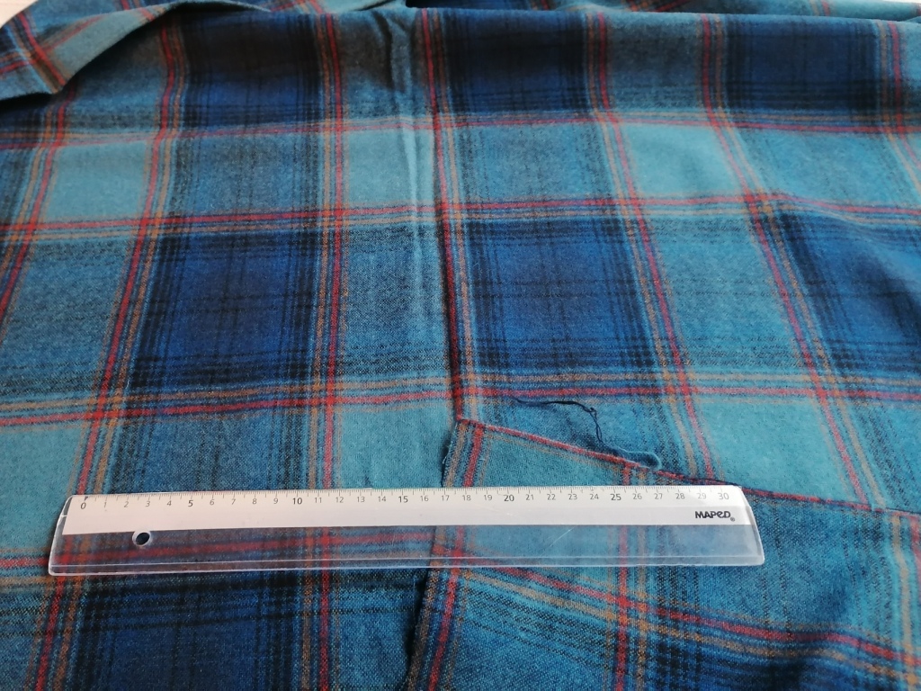Structuur van blauwe wollen ruitstof