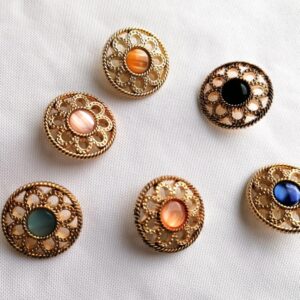 goudkleurige metalen knoop met steentje 27mm