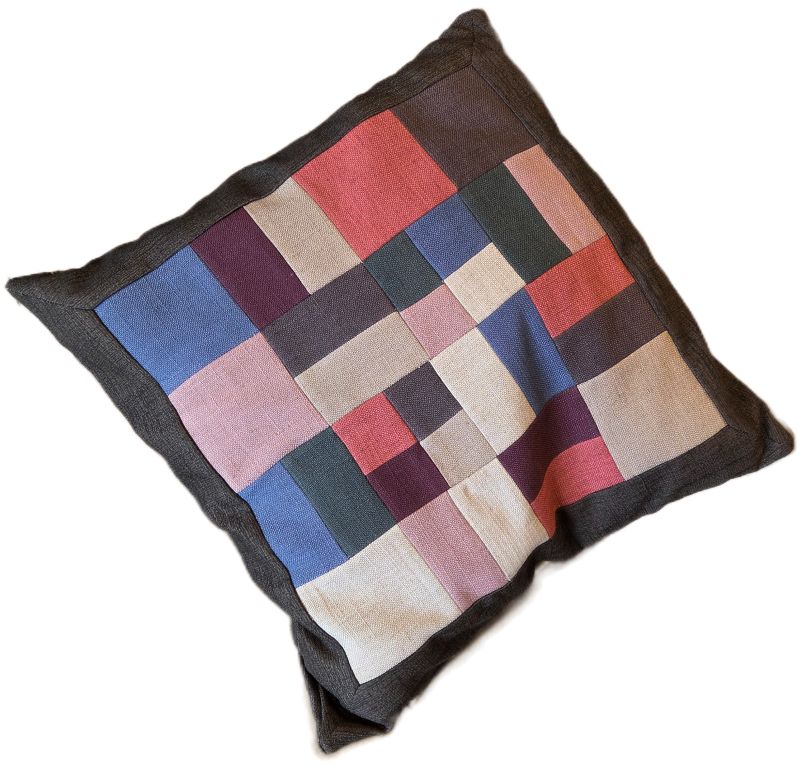 Unieke patchwork kussenhoes 50×50 – warme tinten met bruine rand