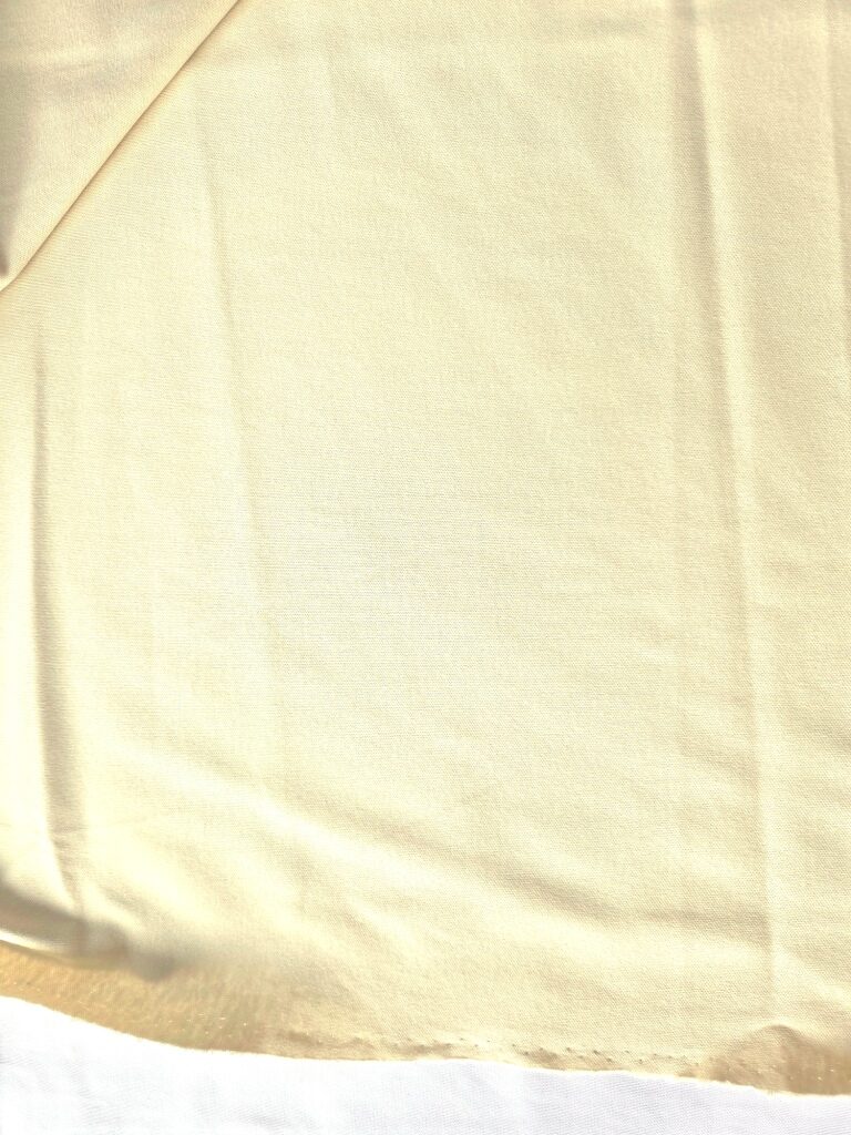 Lichtbeige katoenen jersey stof, detail van de structuur