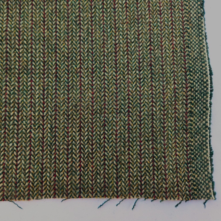 Groenbruine wollen keperstof stevig detail